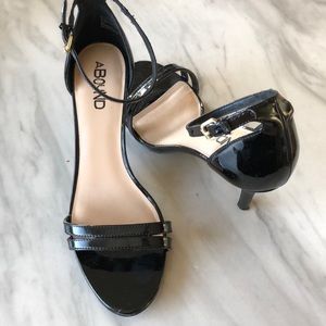 Like new black patent heel pumps with ankle strap